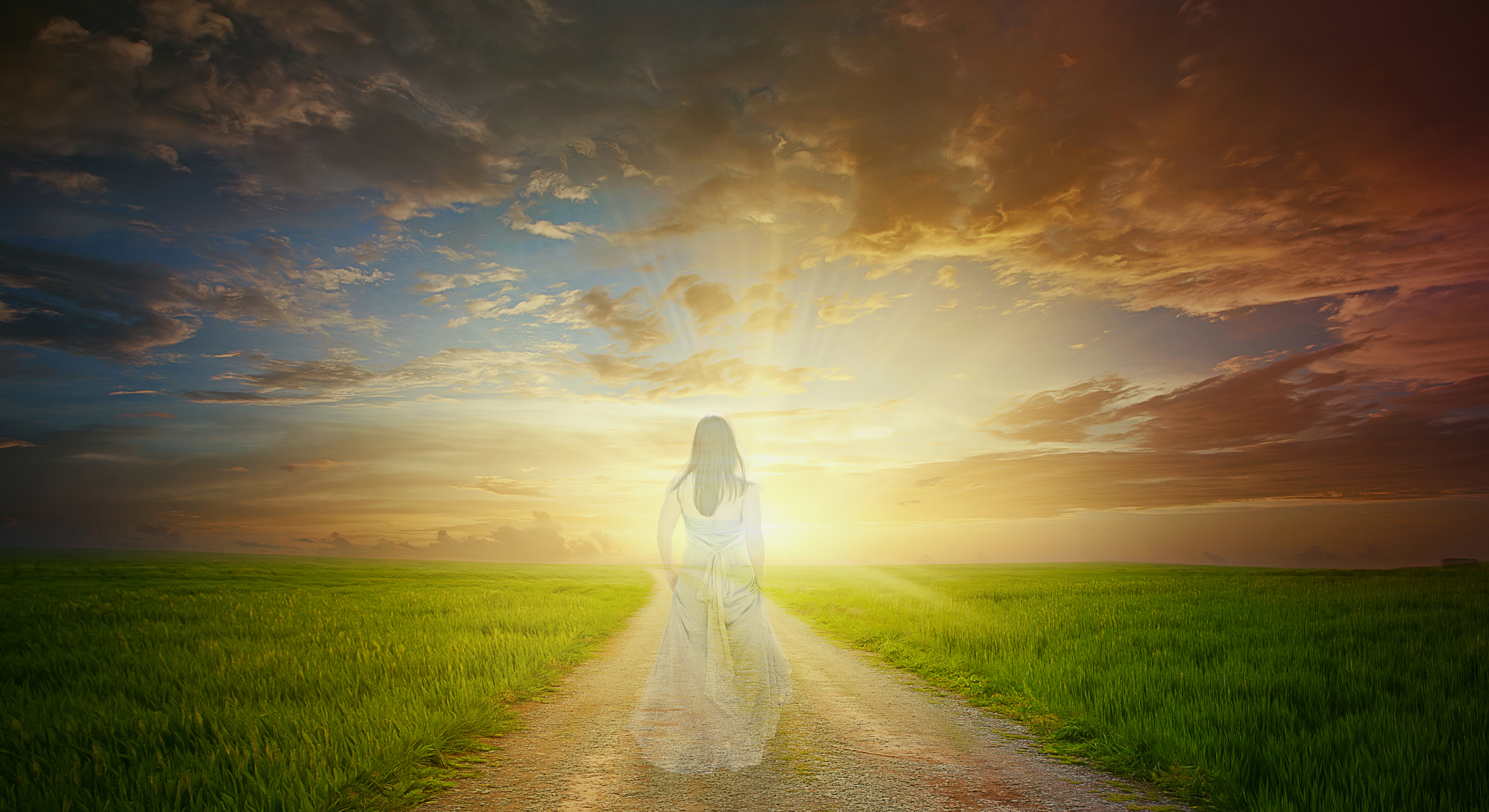 a woman that is tranparent walks the path to the bright sunlight bibwy 9udl